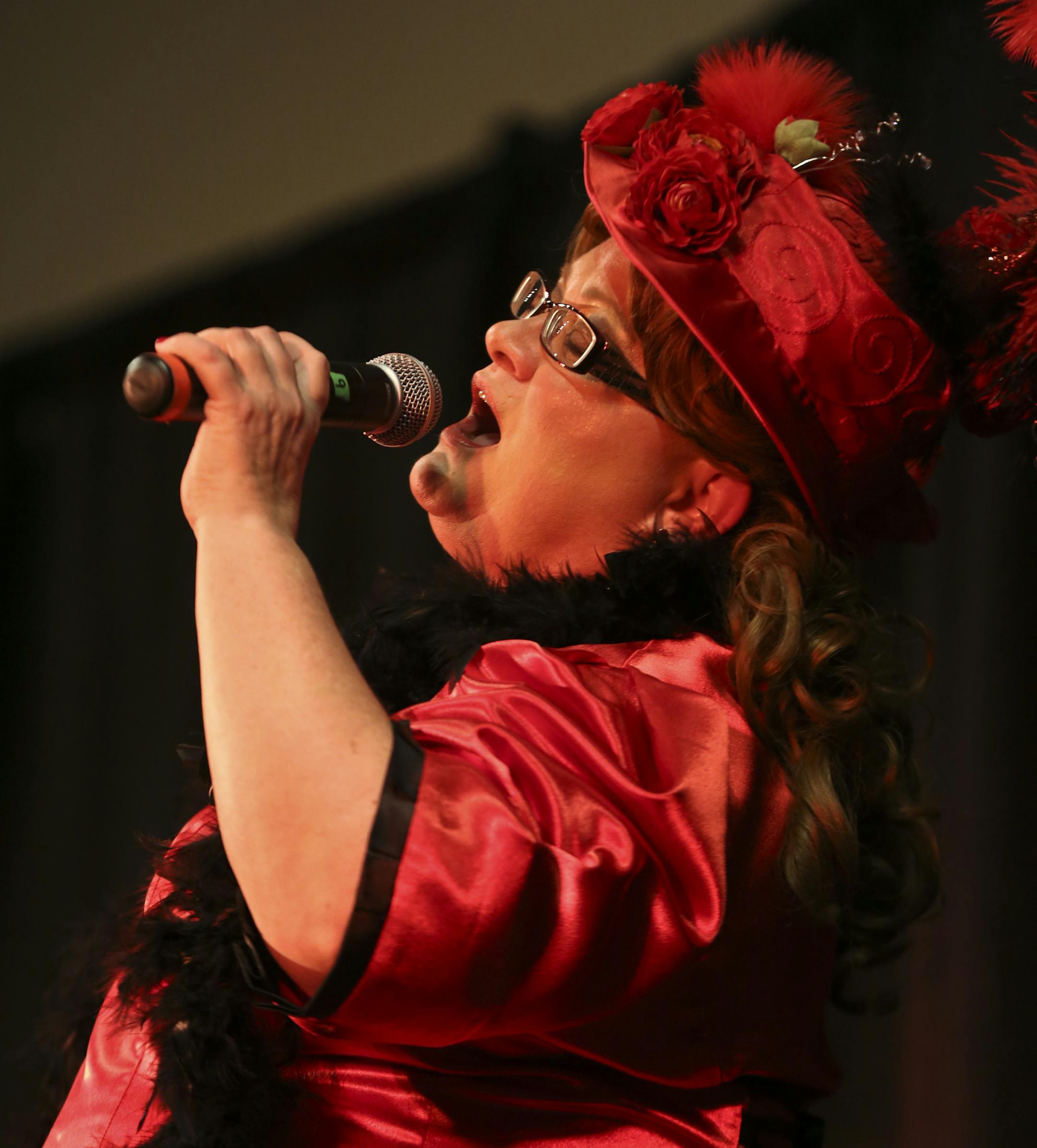 Theresa McConnon sang as she competed during the 2014 Klondike Kate competition in Oakdale, Minn., on Wednesday, January 8, 2014. During the contest six contestants performed up to three songs and were judged on their singing abilities, song choice, costumes, crowd appeal, and their portrayal of the real-life character of Klondike Kate, a woman who struck it rich in the Gold Rush of 1898 as the most famous dance hall girl in the north and has since become a symbol of fun, frivolity and good fell