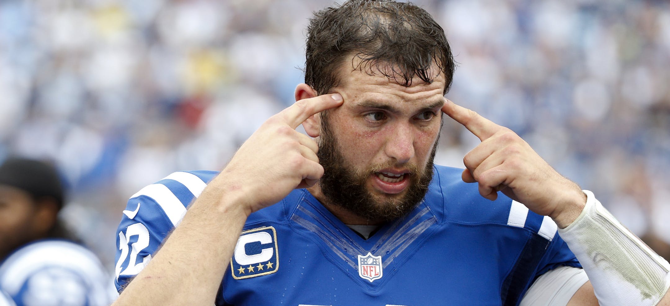 Indianapolis Colts quarterback Andrew Luck talks with teammates on the sideline in the second half of an NFL football game against the Tennessee Titans Sunday, Sept. 27, 2015, in Nashville, Tenn. The Colts won 35-33. (AP Photo/Weston Kenney)