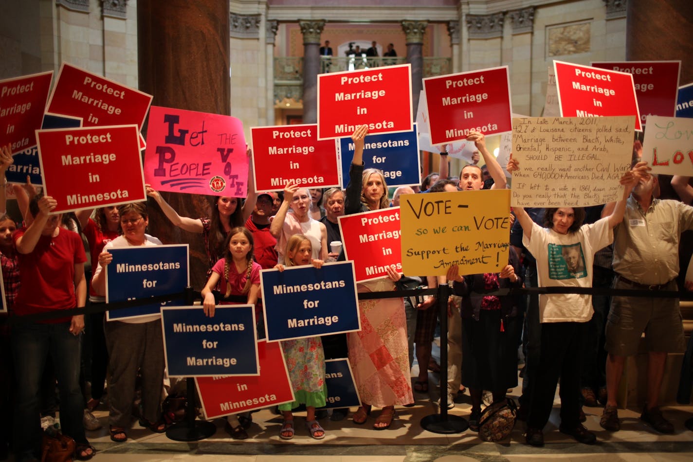 Minnesotans for and against the anti-gay Marriage Amendment gathered outside the House chambers last year.