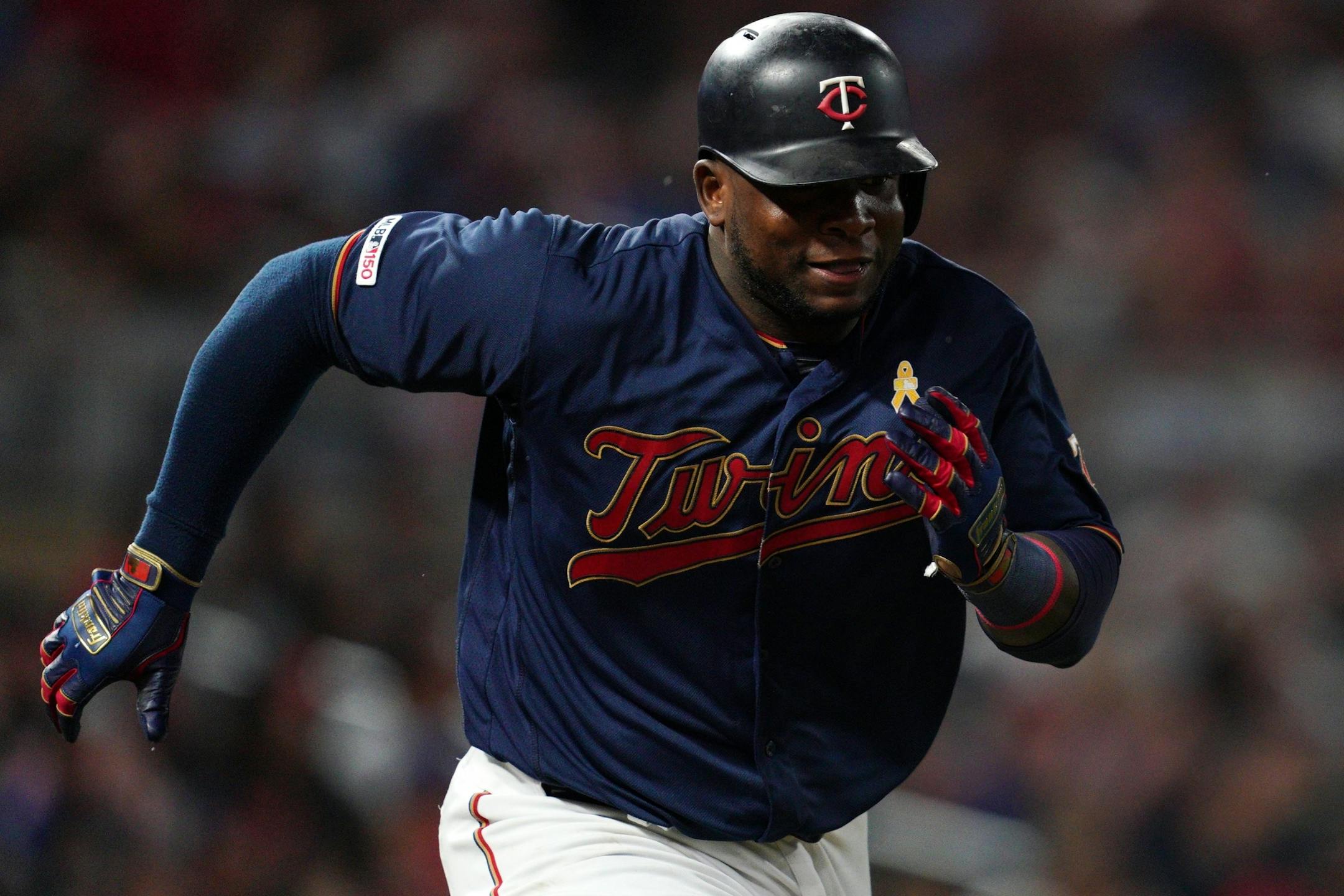 Minnesota Twins third baseman Miguel Sano (22) raced down the first base line after hitting a double in the sixth inning.