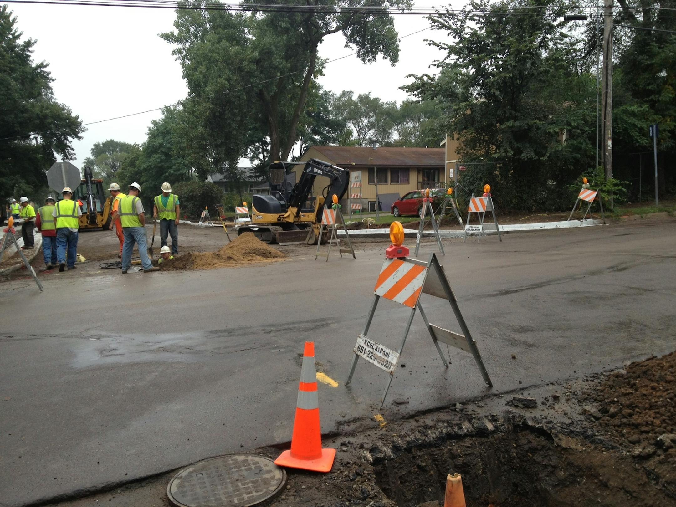 Xcel Energy crews worked at the site of a gas line break near Arlington Avenue and Farrington Street in St. Paul.