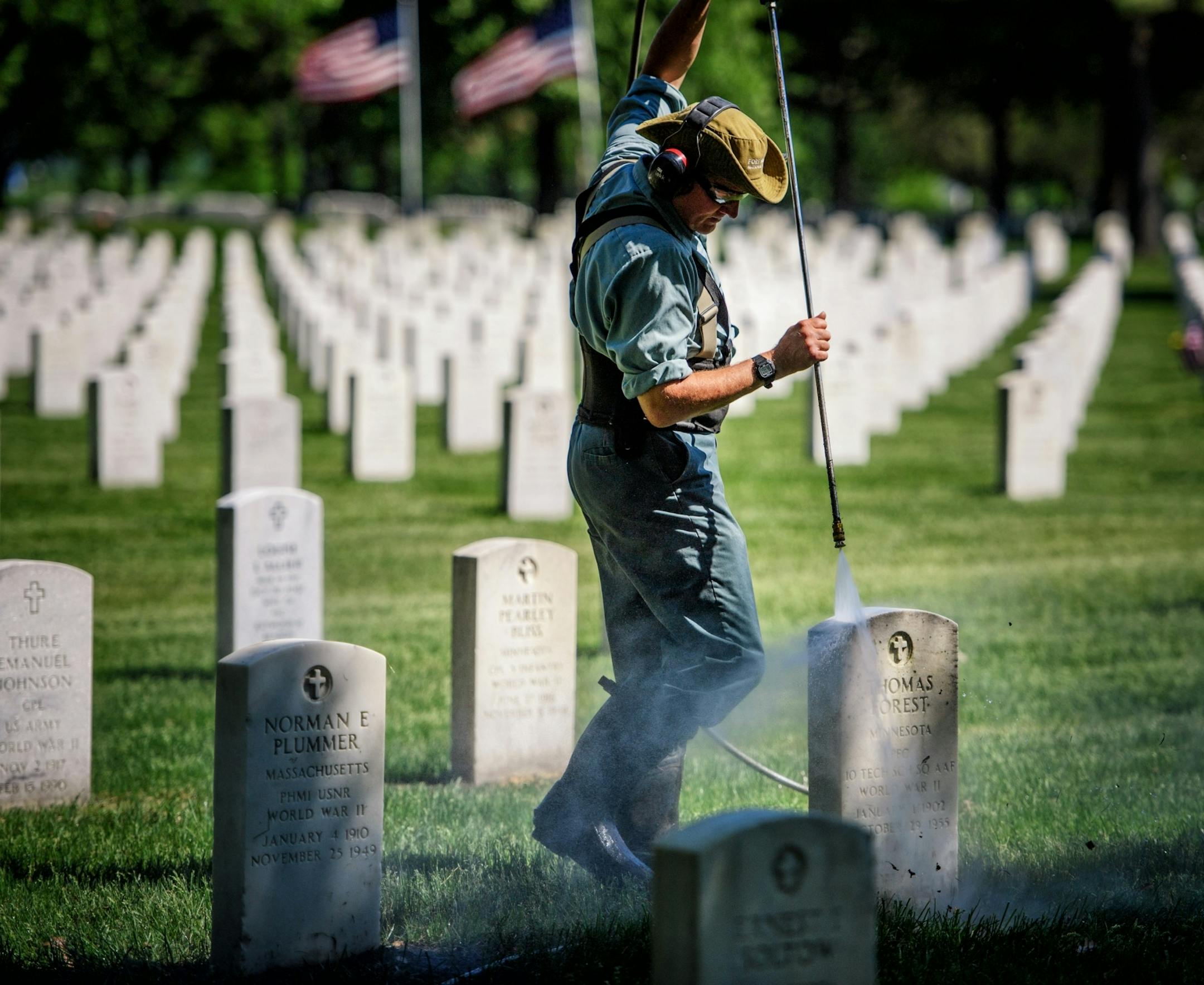 Power washing gravestones is a full time job for Mark Linafelter at Fort Snelling National Cemetery. He averages around 250 per day and around Memorial Day he focuses his attention to the ones under trees that need it the most to keep the place looking good for visitors.