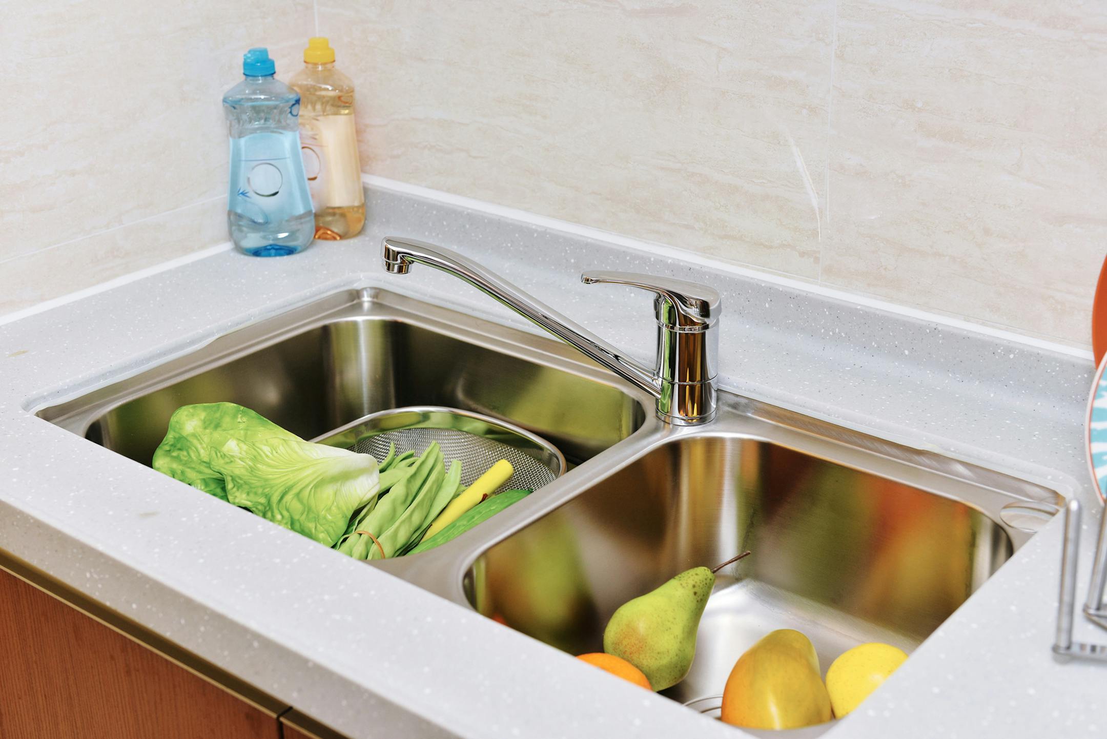 The constant mix of moisture and food in the kitchen sink makes it prone to bacteria like E. coli and salmonella. (Dreamstime)
