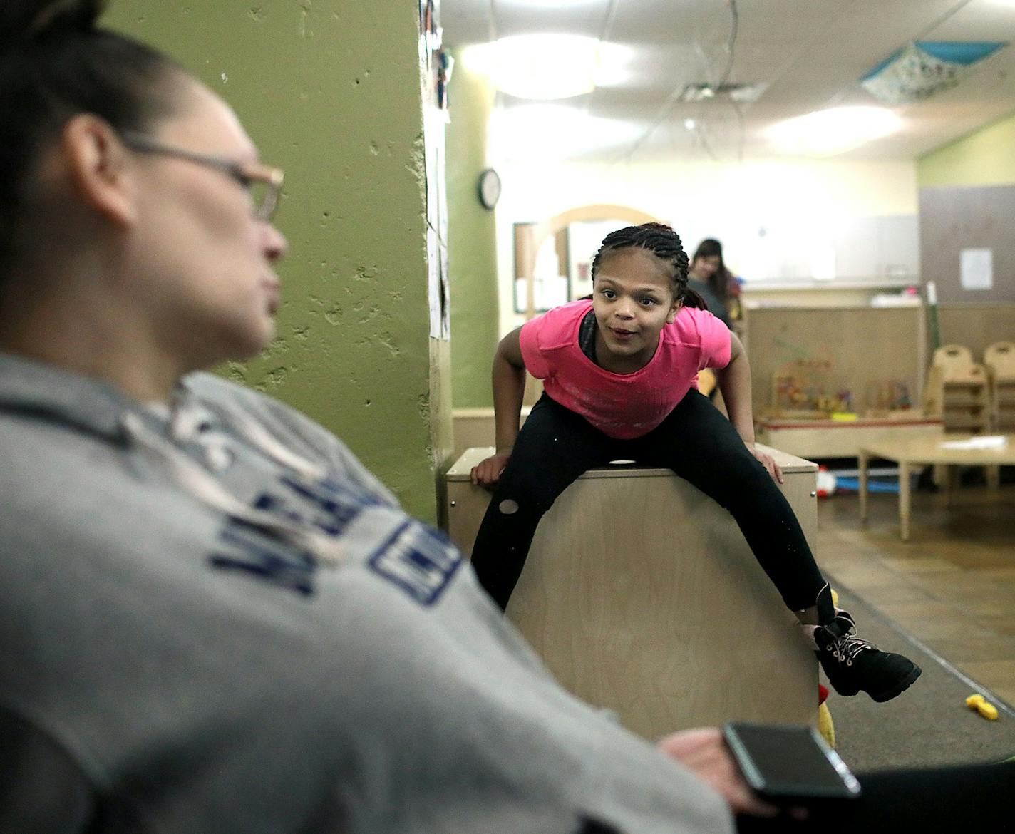 Crystal and six of her seven children are homeless and living temporarily at the People Serving People. Here, Crystal and Nashya, 12, talk at PSP in Minneapolis.