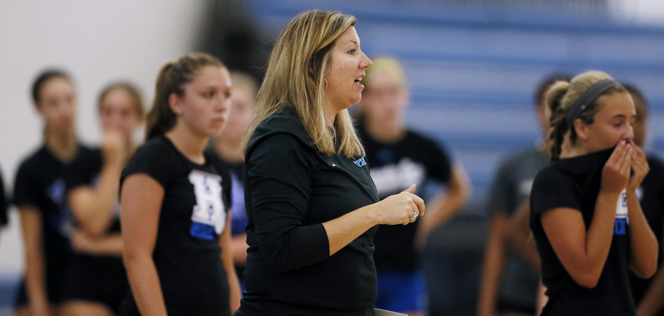 Hopkins coach Vicki Swenson gave instructions during the first day of Royals volleyball practice Monday.