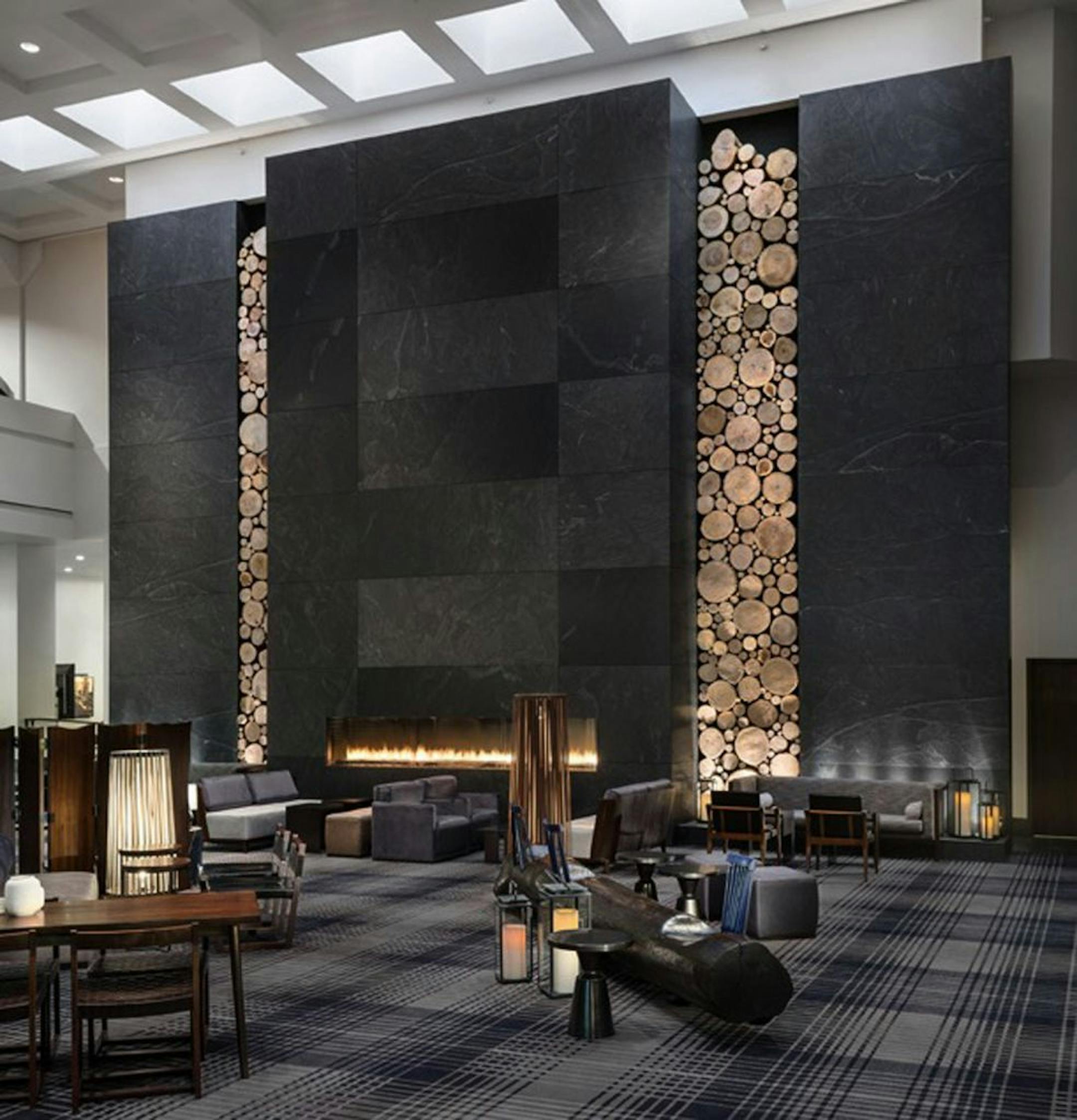 The floor-to-ceiling stone panels and log cuttings in the Hyatt lobby are among the nods to local influences.