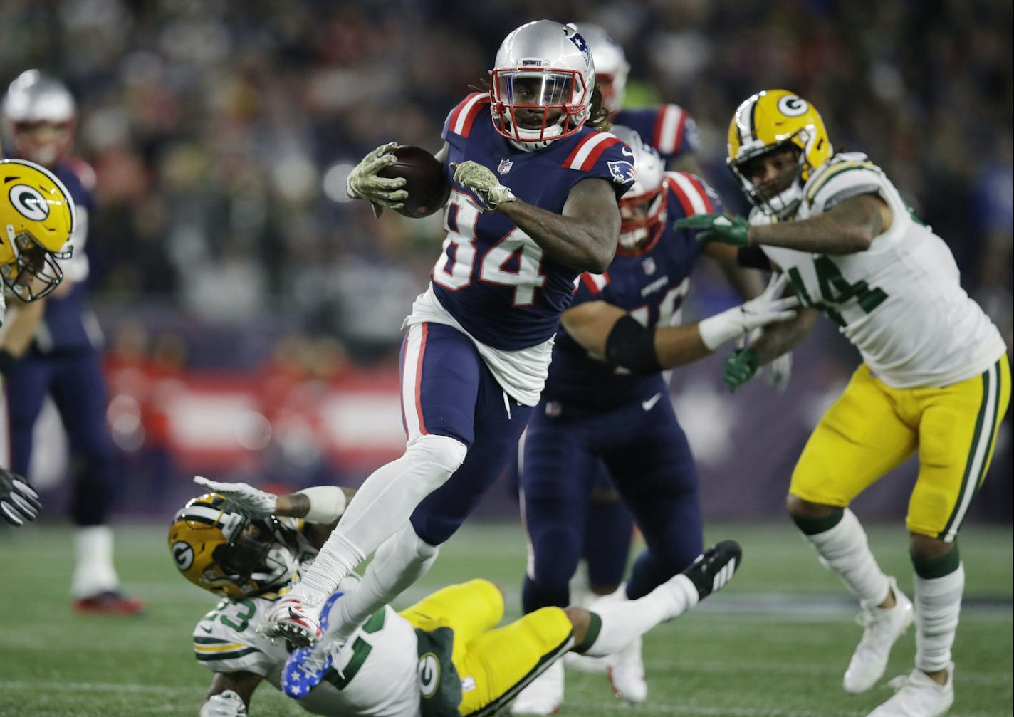 New England Patriots wide receiver Cordarrelle Patterson (84) gains yardage as a running back during the first half of an NFL football game against the Green Bay Packers, Sunday, Nov. 4, 2018, in Foxborough, Mass. (AP Photo/Charles Krupa)