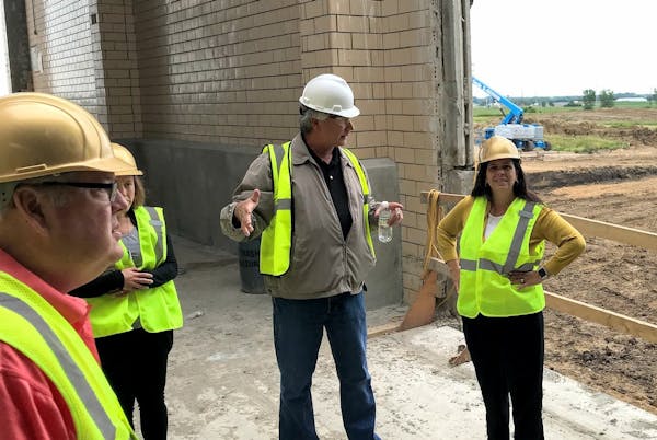 MPCA Commissioner Laura Bishop (right) visited the under-construction Premium Minnesota Pork plant in Luvurne in 2019. PHOTO: MPCA