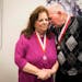 Dorothy Noga, the civilian who helped break the case, shares a moment with retired St. Paul Police officer James Groh, who worked on the case, after t