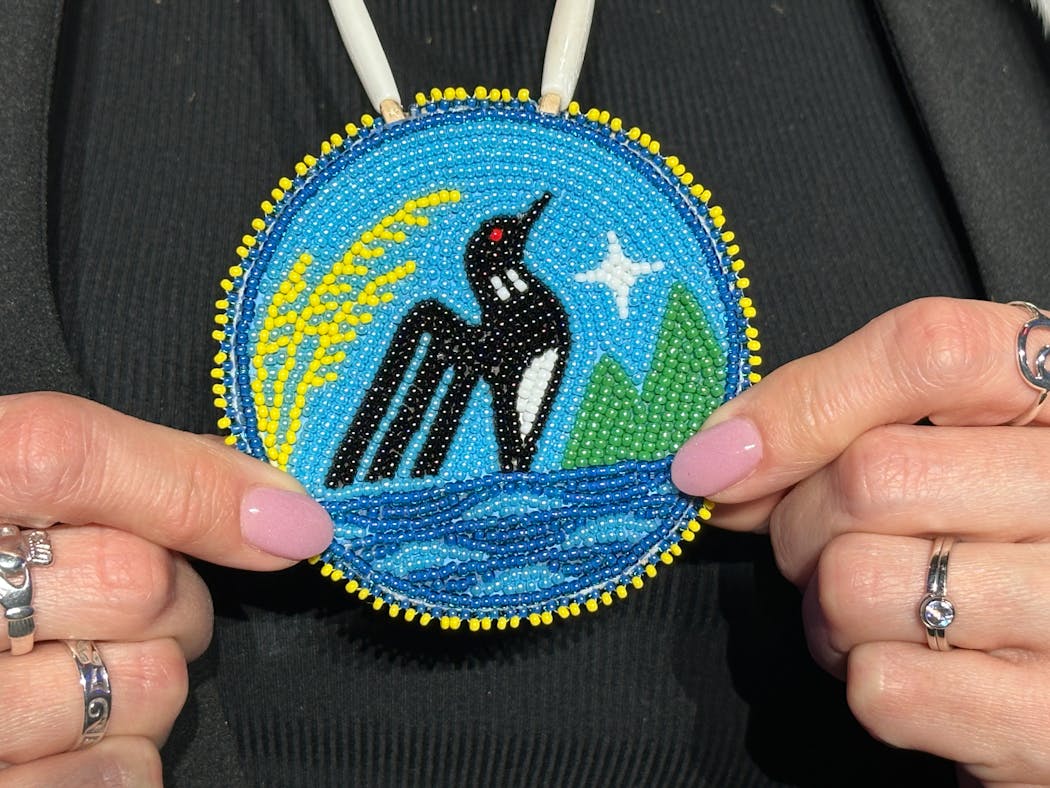 Lt. Gov. Peggy Flanagan wore a beaded medallion of the new state seal, made by her friend, Amy Ojibway.