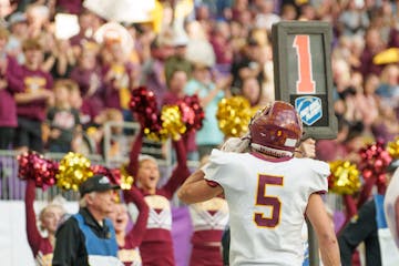 Stewartville running back Carter Miller gave his fans a listen after a touchdown in the Class 3A seifinminals5) celebrates with the student section af