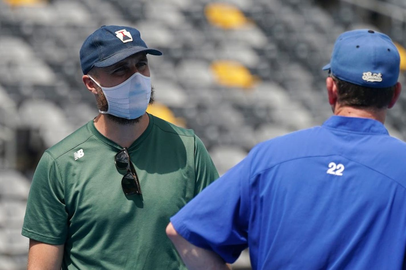 Minnesota Twins manager Rocco Baldelli spoke with Saints manager George Tsamis during a practice at CHS Field. The Saints aren't being allowed to play games there, so they will play home games in Sioux Falls.