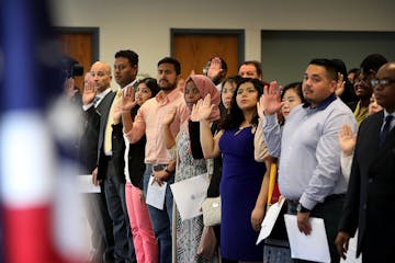 Ninety-four people took the oath of allegiance from Judge William J. Fisher and became new U.S. citizens during a naturalization ceremony on Wednesday