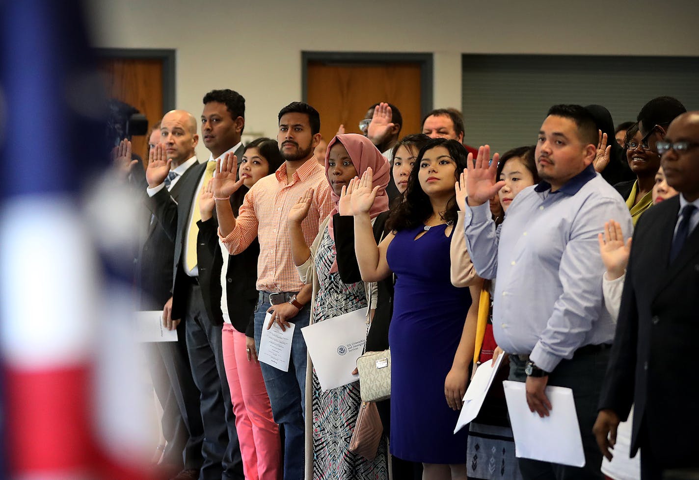 Ninety-four people took the oath of allegiance from Judge William J. Fisher and became new U.S. citizens during a naturalization ceremony on Wednesday at the Roseville Skating Center. The city&#x2019;s immigrant population is mostly Karen refugees from Myanmar.