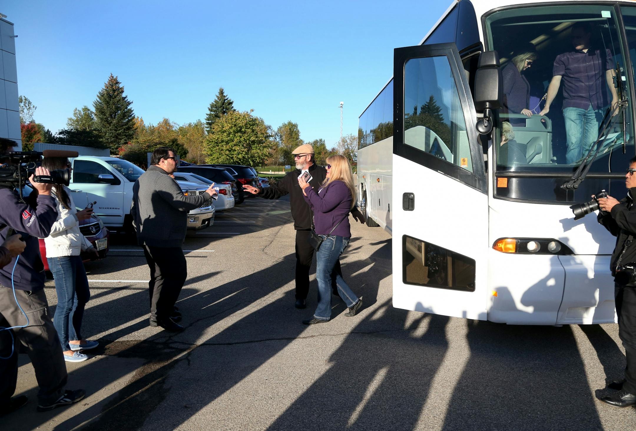 Super Prince fan Chris Skluzacek of Montgomery, center in purple, was the first off the bus carrying the first fans to get inside the new Paisley Park Tour Thursday, Oct. 6, 2016, in Chanhassen, MN.