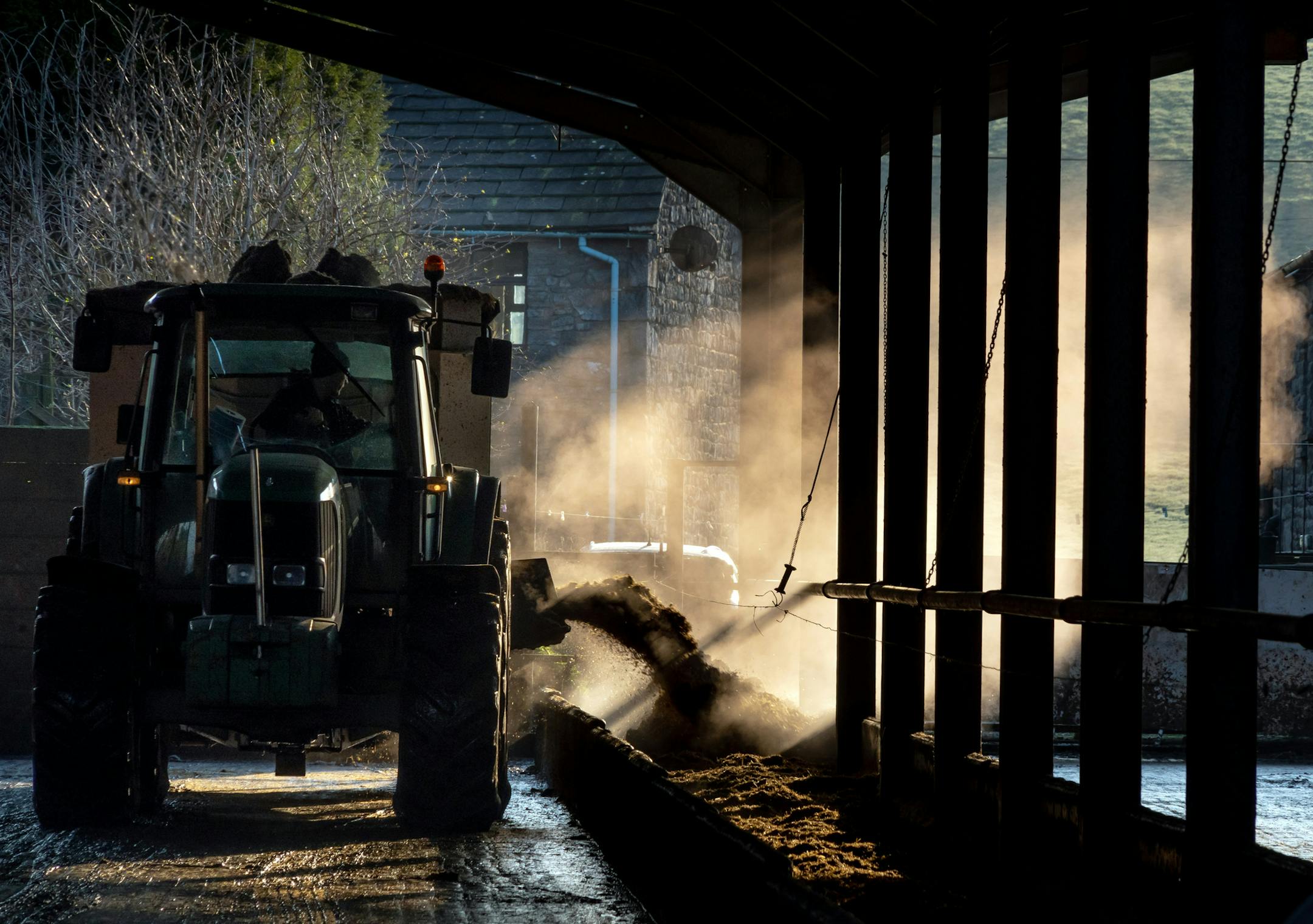 The cattle trough is filled at Brades Farm in Lancaster, England, on March 6, 2020. Brades Farm has found a niche selling climate-friendly milk to cafes and artisanal baristas around Britain. (Andrew Testa/The New York Times)