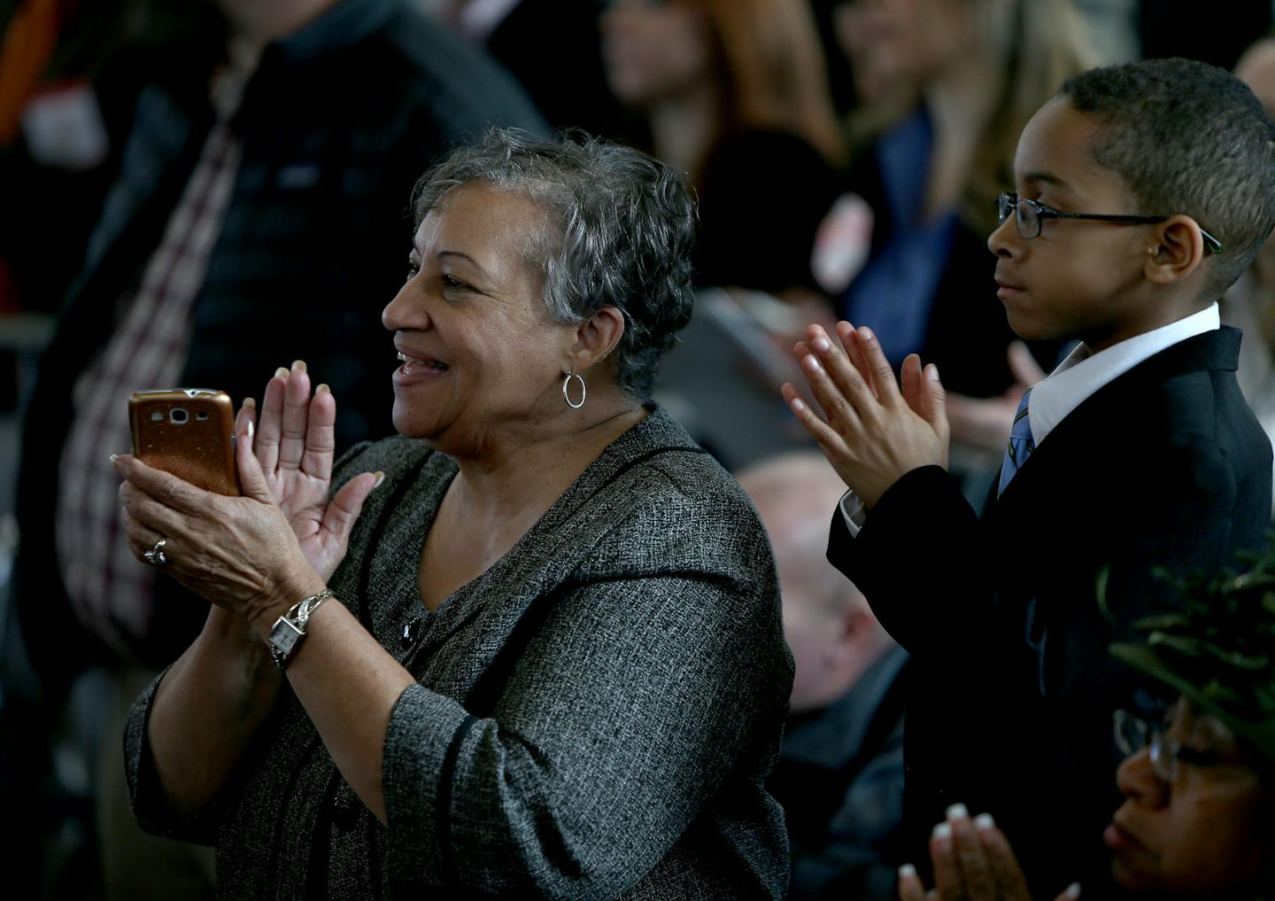 Danya Day, left, and her grandson Jonathan Brooks, 6, of Woodbury, clapped President Barack Obama's visit to the Union Depot, Wednesday, February 26, 2014 in St. Paul, MN. (ELIZABETH FLORES/STAR TRIBUNE) ELIZABETH FLORES &#x2022; eflores@startribune.com