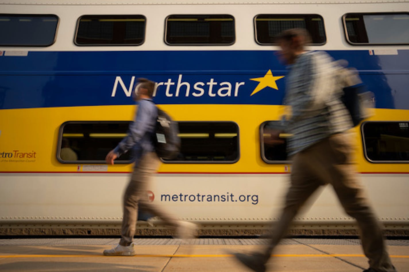 Northstar Commuter Rail passengers walked to the 4:27 p.m. train at the Target Field Station Wednesday afternoon, September 14, 2002 in Minneapolis. A rail strike looming across the United States and could pose havoc on passenger service here and elsewhere. Empire Service is shut down, Northstar Commuter Rail could be soon. ] JEFF WHEELER • Jeff.Wheeler@startribune.com