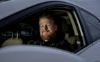 Zach Bohlman photographed in the car he uses to drive for Uber and Lyft. ] CARLOS GONZALEZ &#x2022; cgonzalez@startribune.com &#x2013; January 21, 201