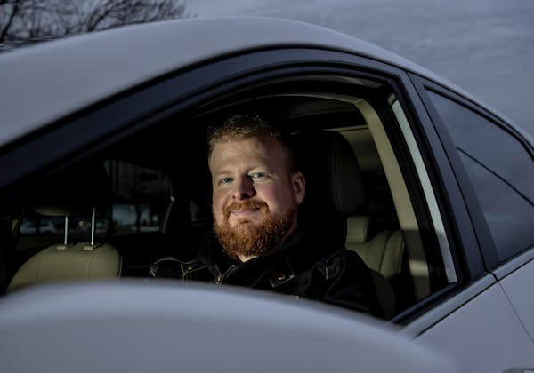 Zach Bohlman photographed in the car he uses to drive for Uber and Lyft. ] CARLOS GONZALEZ &#x2022; cgonzalez@startribune.com &#x2013; January 21, 201