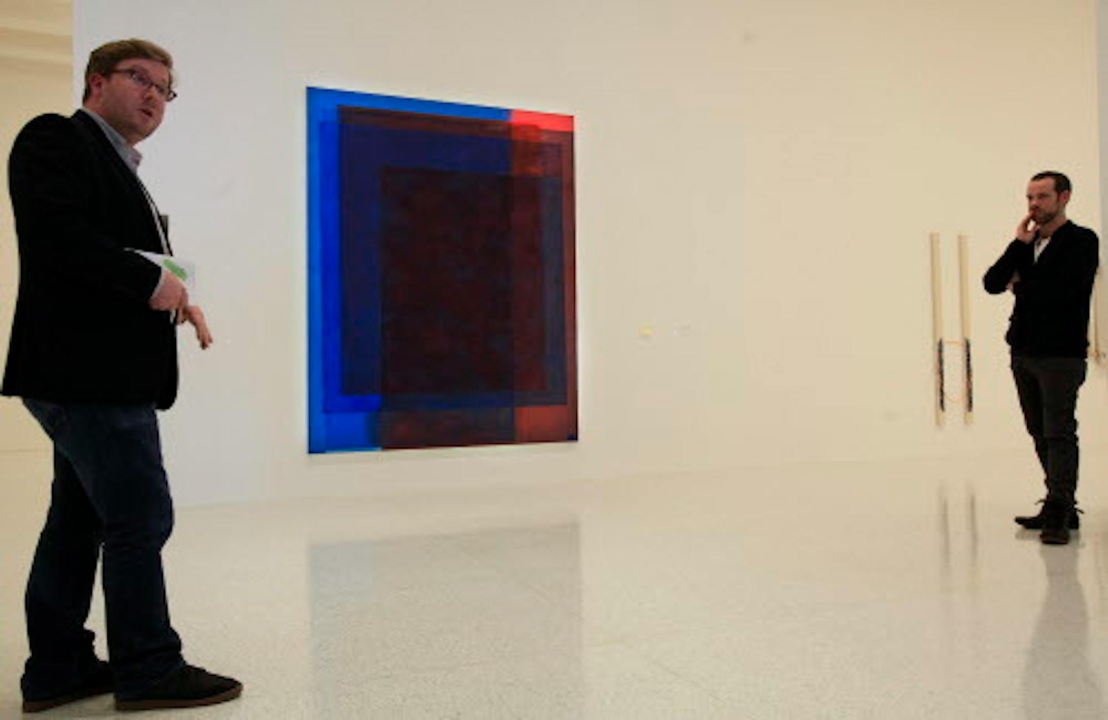 Curators Eric Crosby (left) and Bartholomew Ryan spoke about Matt Connors work.  Matt Connors b. Chicago, 1973; lives and works in New York.  First Straight Third (red/blue) 2013.  Acrylic on canvas.   "Painter Painter" show at Walker Art Center in Minneapolis, MN, a show of abstract art by 15 contemporary talents.  February 1, 2013.    ] JOELKOYAMA•joel.koyama@startribune.com