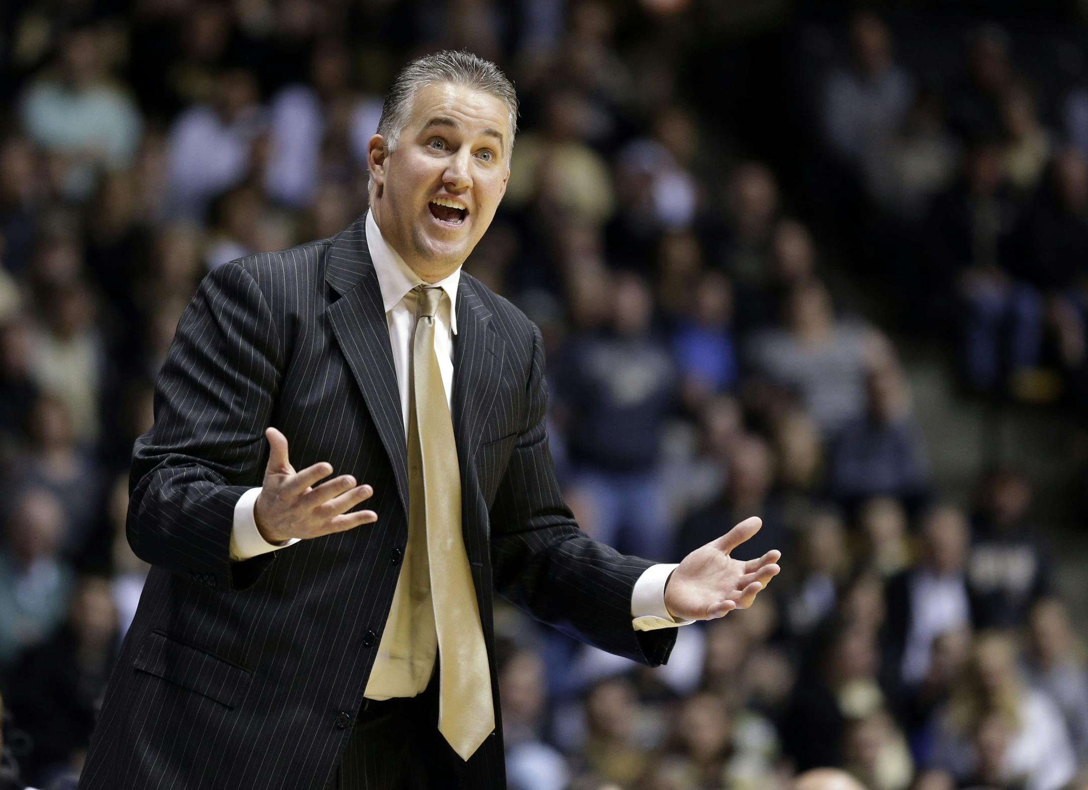 Purdue head coach Matt Painter questions a call against his team as they played Rutgers in the first half of an NCAA college basketball game in West Lafayette, Ind., Thursday, Feb. 26, 2015. (AP Photo/Michael Conroy) ORG XMIT: INMC108