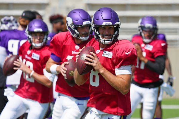 Kirk Cousins, front, works out with other Vikings quarterbacks Sean Mannion, Nick Mullens and Kellen Mond at practice Thursday.