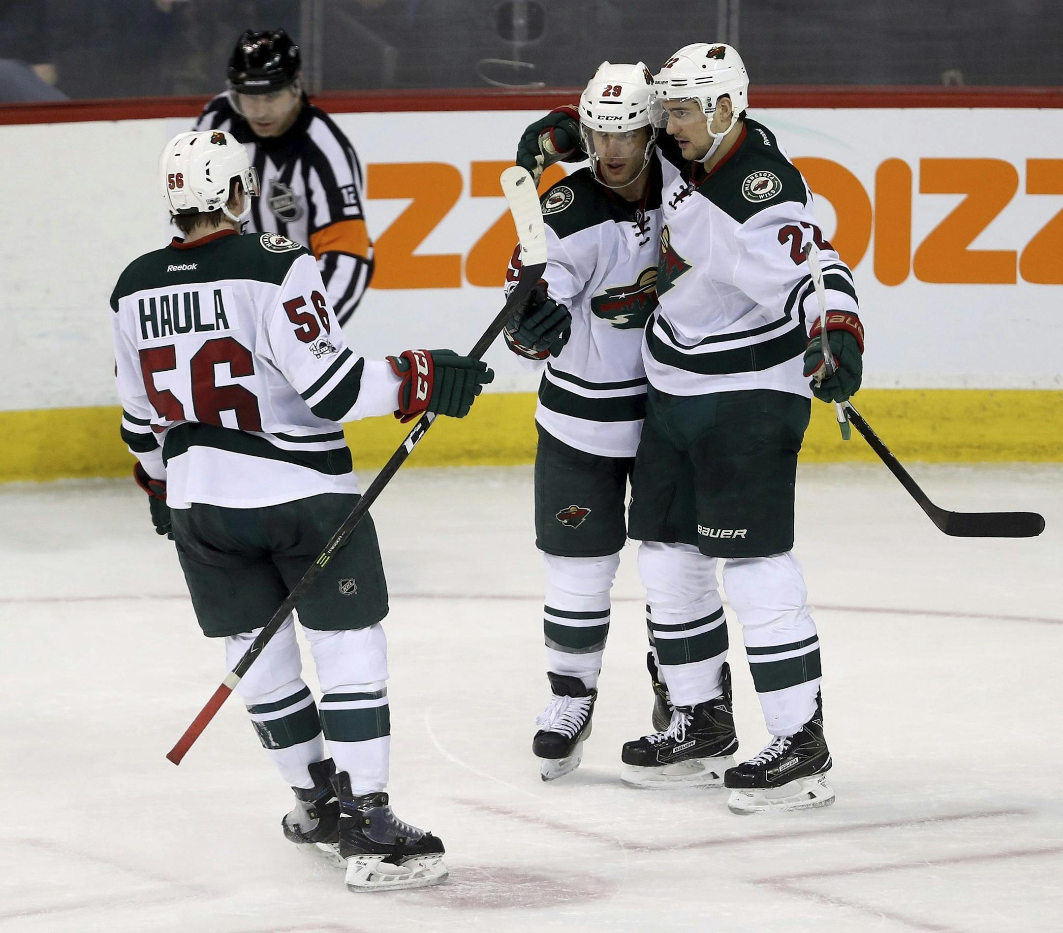 Erik Haula (56), Jason Pominville (29) and Nino Niederreiter celebrated against the Jets on Tuesday in Winnipeg. Going into Wednesday night’s game, the Wild has the second-best winning percentage (.721) in the NHL.