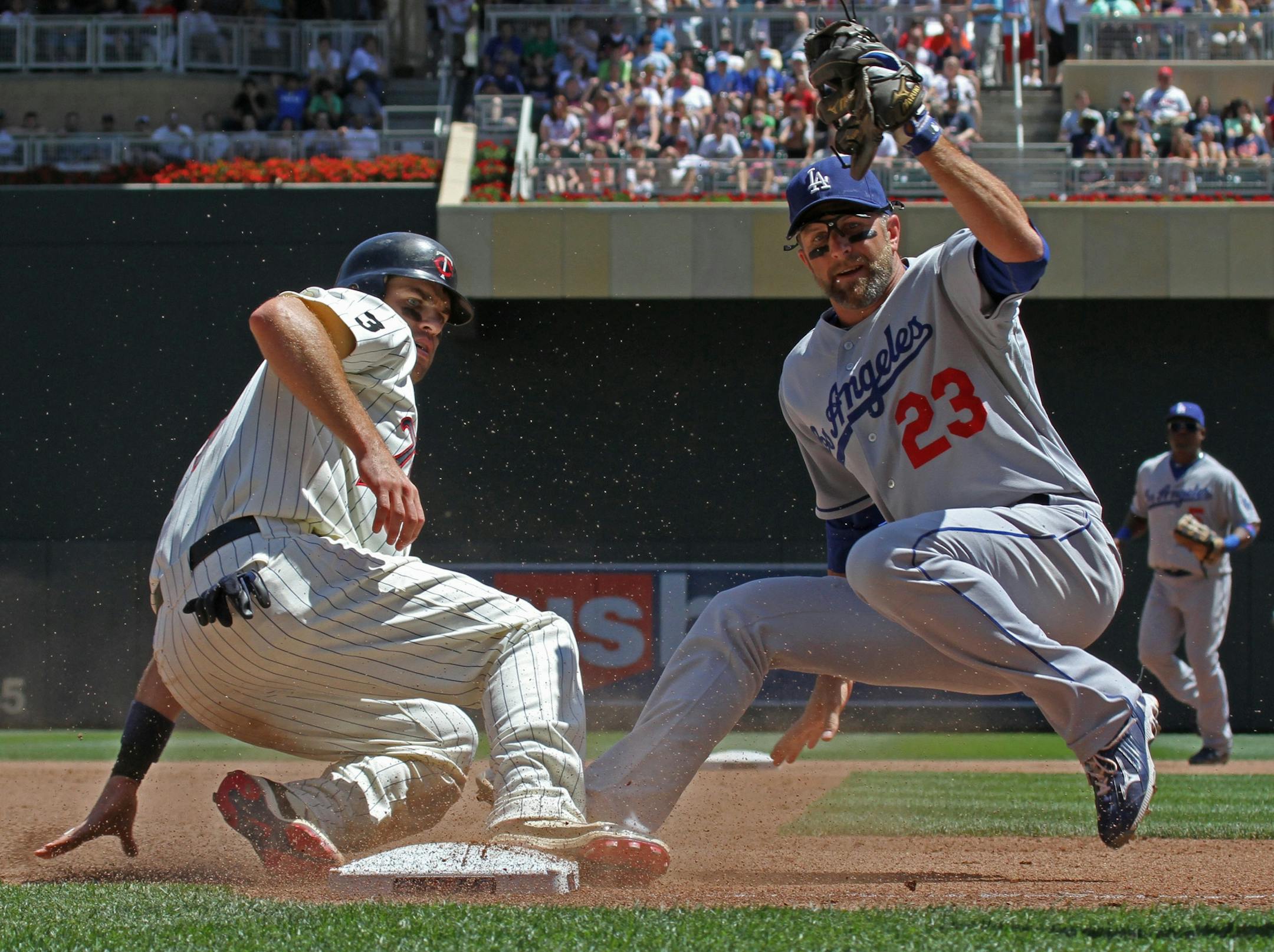 Minnesota Twins Joe Mauer was tagged out as he tried to take 3rd base by Los Angles Dodgers Casey Blake in 6th inning action.