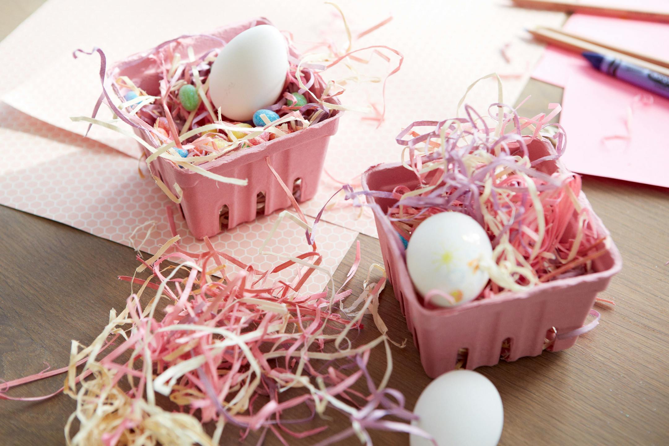 Berry containers, $8 for set of six; Easter grass, $2; pencil set of 12, $8; one dozen art eggs, $3; 32-count mica eggs, $2, and honeycomb art paper, 60 cents per sheet; all from Michaels. Sheet stickers, $1, from Target.