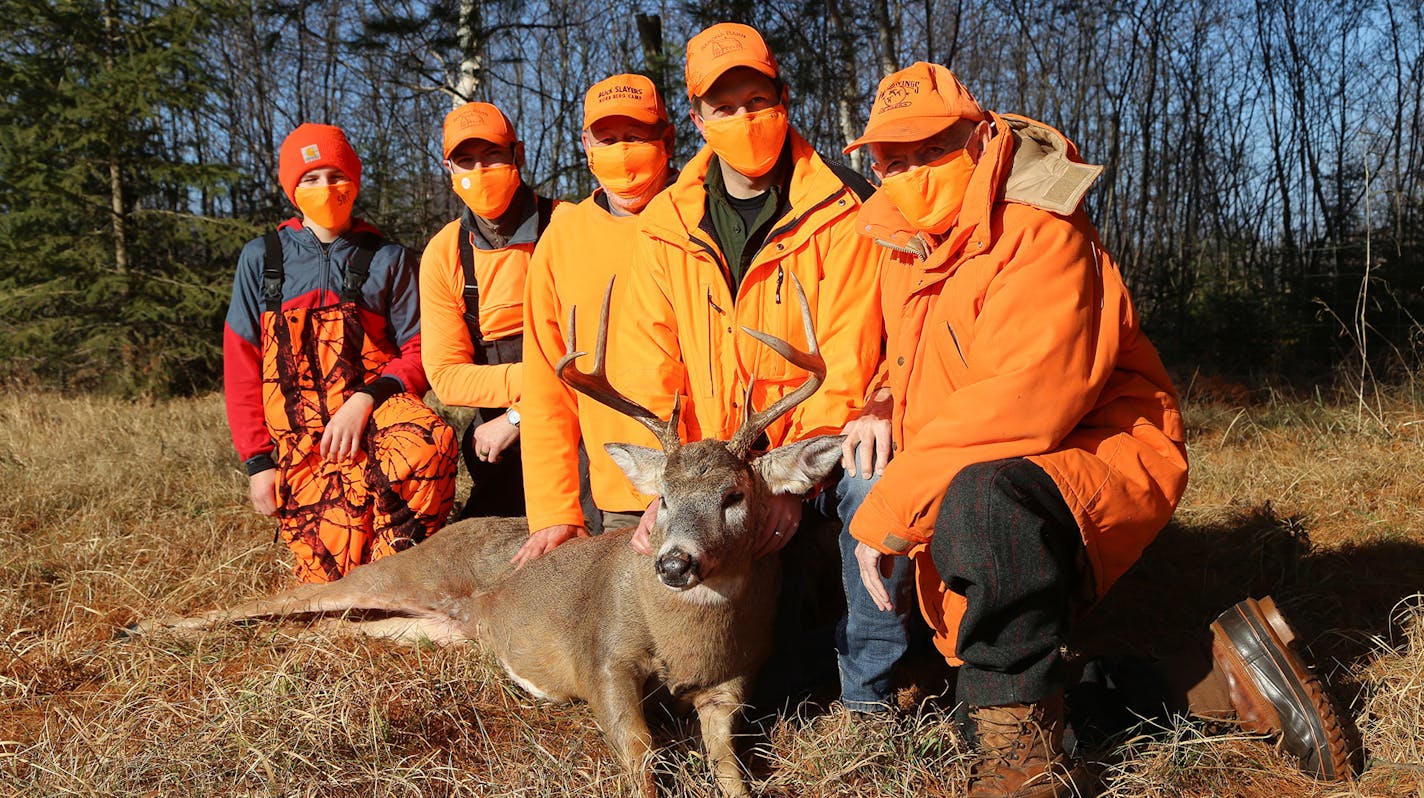 Saturday brought together four generations of hunters in northwestern Wisconsin. Norb Berg, right, of St. Paul, age 88, with, from left, great-grandson, Sean Thornton, 15; Sean's dad, Charley Thornton, 37; son, Tony Berg, 59; and grandson Frank Brannon, 37. Brannon downed the big 8-pointer.