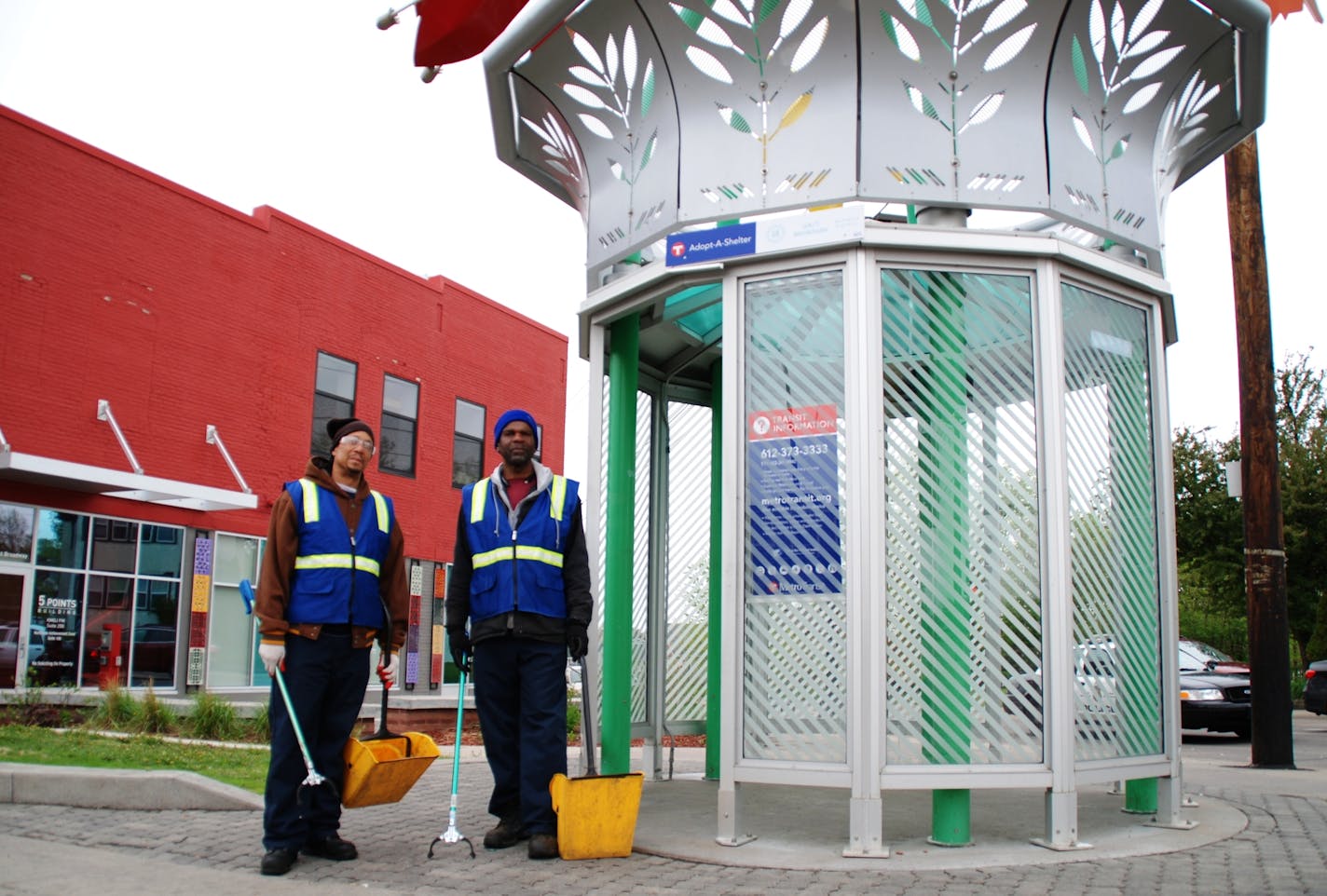 Workers pick up litter on West Broadway Avenue in north Minneapolis.