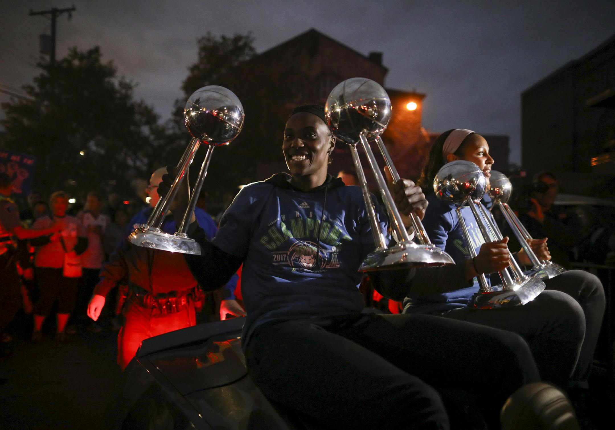 Minnesota Lynx players Sylvia Fowles, left and Maya Moore held up all four WNBA Championship trophies as they arrived at Williams Arena for the celebration Thursday night. ] JEFF WHEELER ï jeff.wheeler@startribune.com The Minnesota Lynx celebrated their fourth WNBA championship with a parade on University Ave. culminating with a rally at Williams Arena Thursday night, October 5, 2017 in Minneapolis.