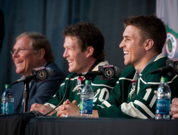 Wild Owner Craig Leipold, Ryan Suter and Zach Parise on July 9, 2012 after the two players signed identical contracts.