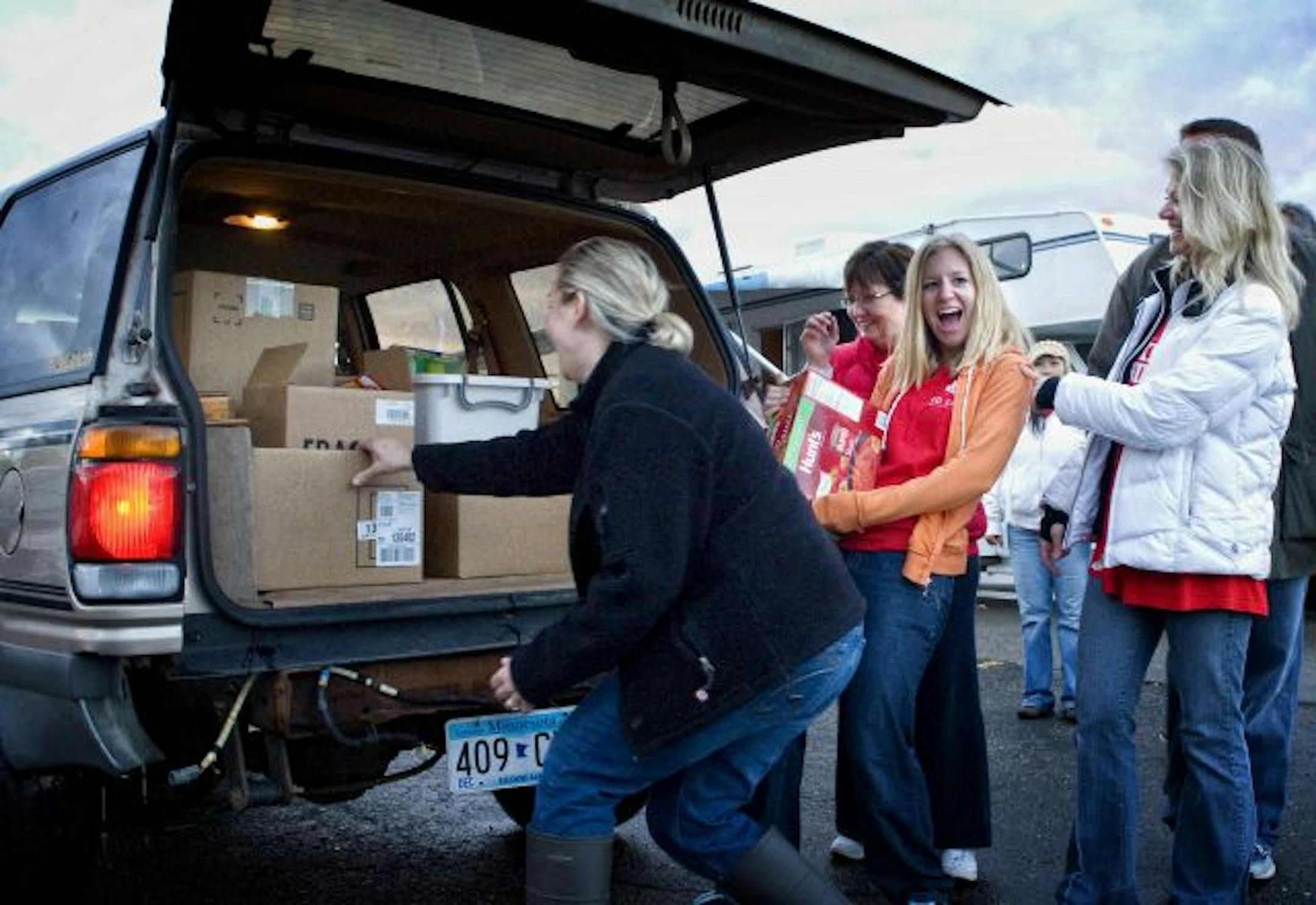 Keler Williams employees Andrea Theis, Shelley Williams, Abbie Foster and Rochelle Johnson unloaded a vehicle of donated food during their Food Drive.