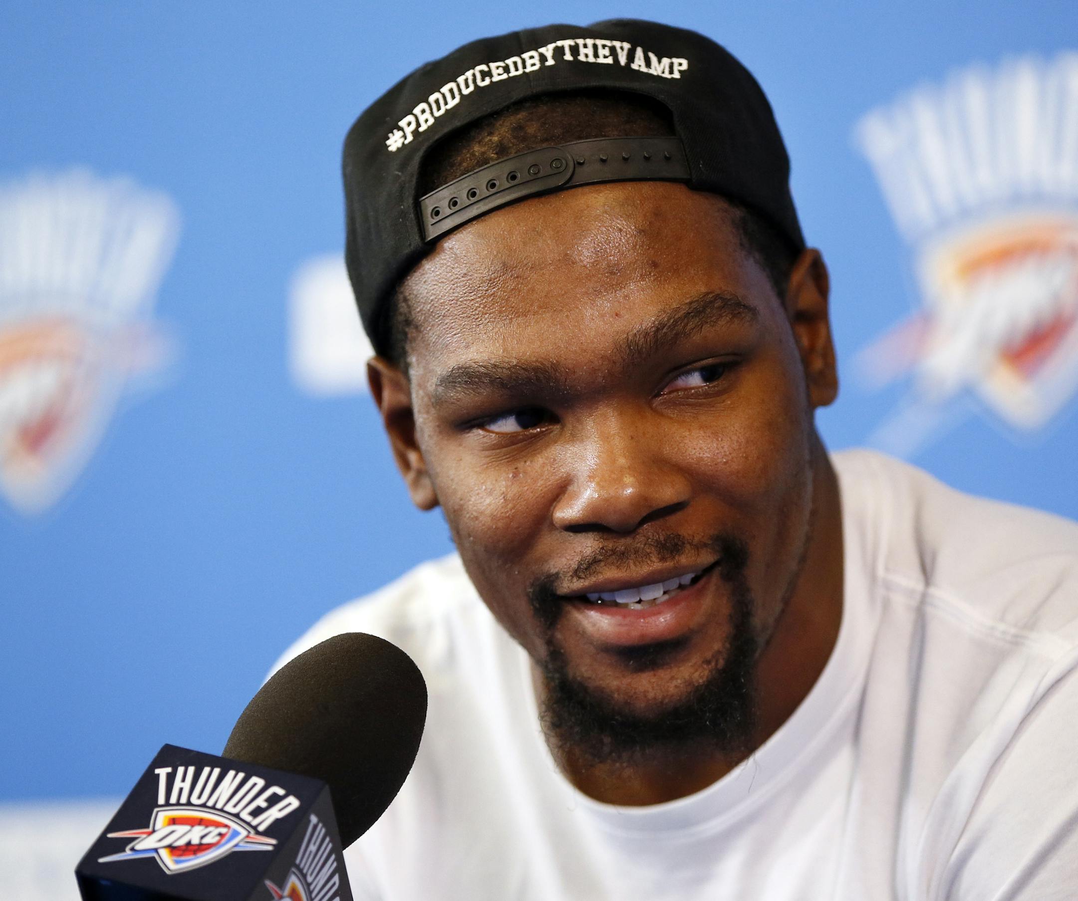 FILE - In a Wednesday, June 1, 2016 file photo, Oklahoma City's Kevin Durant (35) speaks during a news conference at the team's practice facility in Oklahoma City. Durant announced Monday, July 4, 2016 that he is joining All-Stars Stephen Curry and Klay Thompson with the Golden State Warriors. Durant made the decision public on The Players’ Tribune Monday morning. He can’t officially sign until July 7. (Nate Billings/The Oklahoman via AP, File) LOCAL STATIONS OUT (KFOR, KOCO, KWTV,