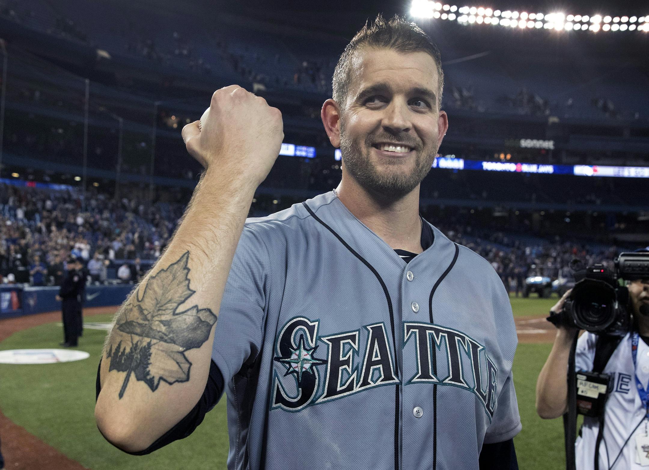 Seattle Mariners starting pitcher James Paxton shows off his Maple Leaf tattoo after pitching a no-hitter against the Toronto Blue Jays in a baseball game Tuesday, May 8, 2018, in Toronto. (Fred Thornhill/The Canadian Press via AP)