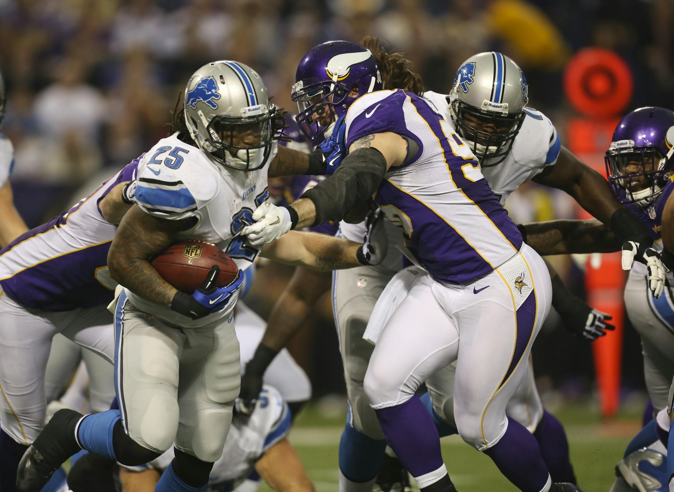 Vikings defensive end Brian Robison grabbed Lions running back Mikel Leshoure during the third-quarter Sunday.