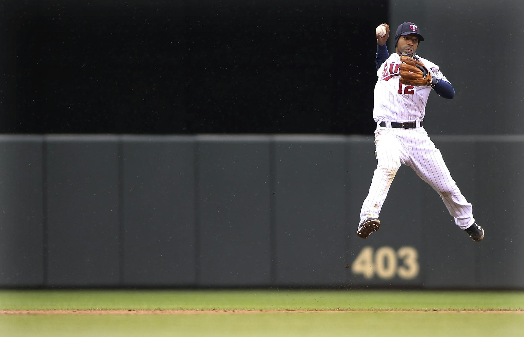 Twins' Alexi Casilla went up to attempt an out at first but wasn't able to during the ninth inning.