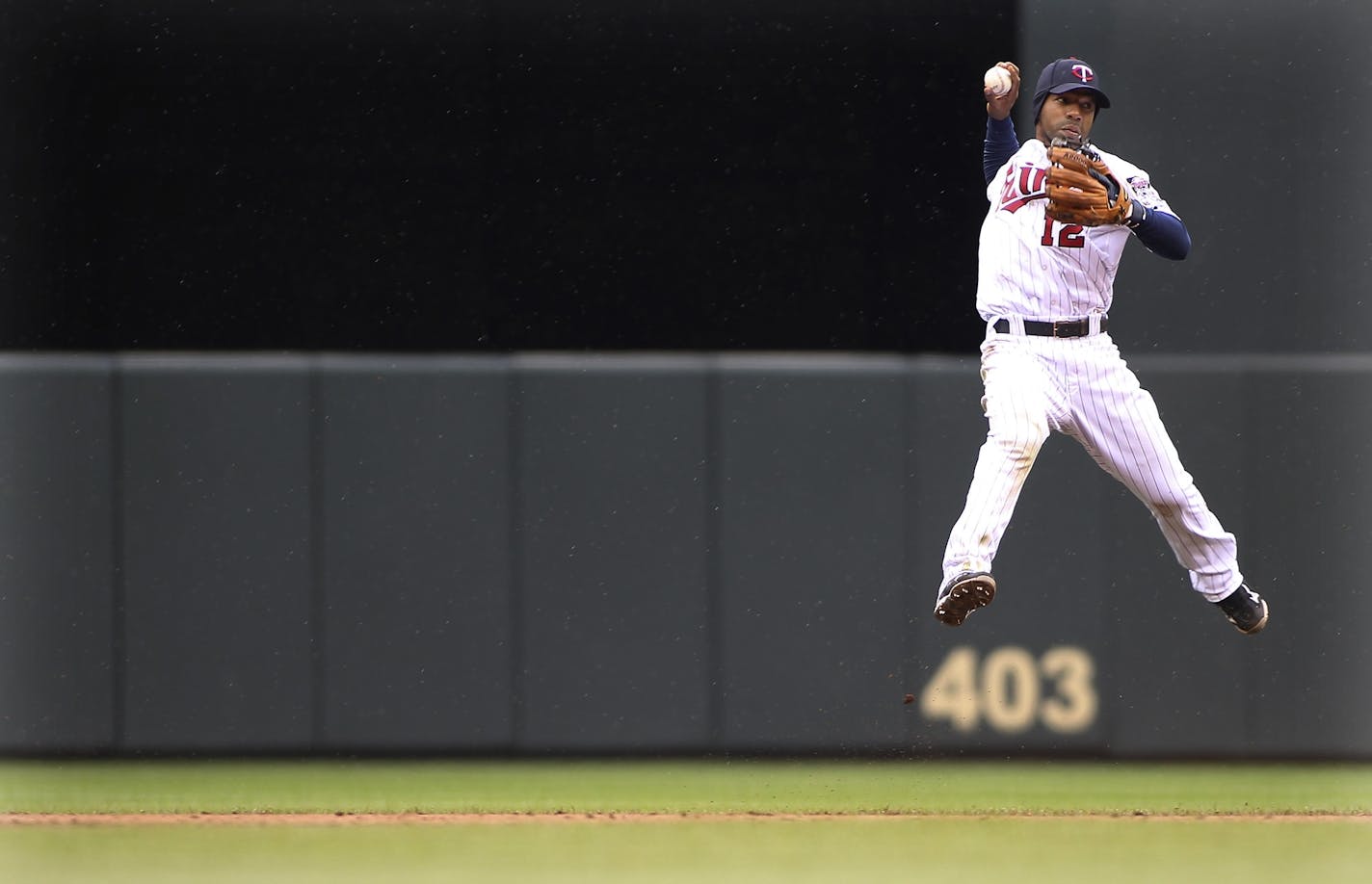 Twins' Alexi Casilla went up to attempt an out at first but wasn't able to during the ninth inning.