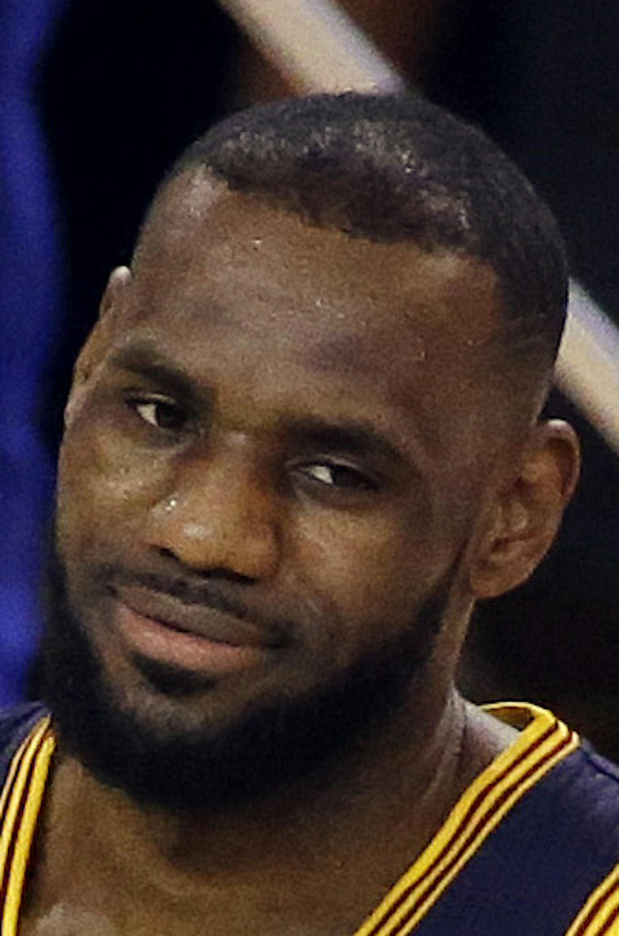 Cleveland Cavaliers forward LeBron James (23) reacts during the first half of Game 5 of basketball's NBA Finals against the Golden State Warriors in Oakland, Calif., Sunday, June 14, 2015. (AP Photo/Eric Risberg)