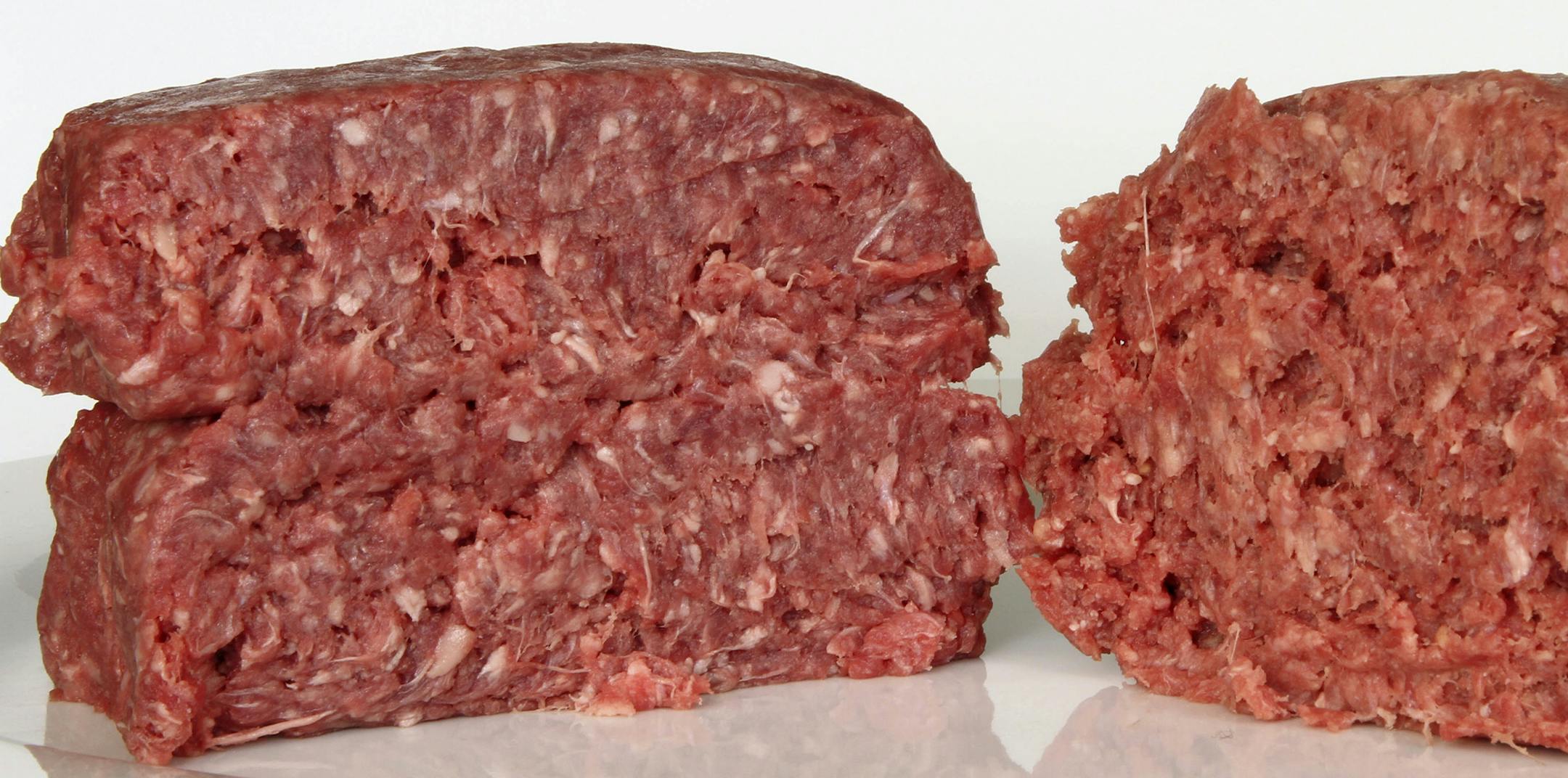 This Thursday, March 15, 2012 photo shows ground beef containing what is derisively referred to as "pink slime," or what the meat industry calls "lean, finely textured beef," right, and pure 85% lean ground beef, in Concord, N.H.