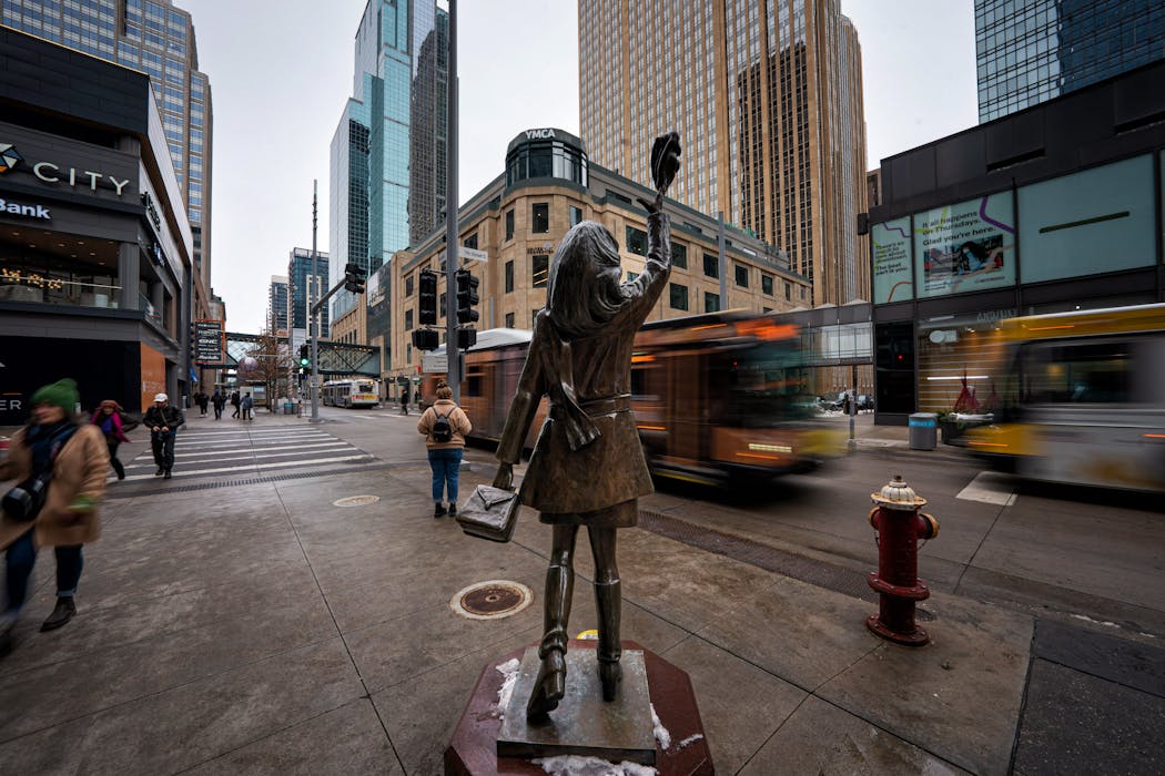 The Mary Tyler Moore statue stands at the corner of Nicollet Mall and 7th Street. On the left is City Center where Marshalls is leaving, and on the right is the closed Nordstrom Rack store in the IDS Center.