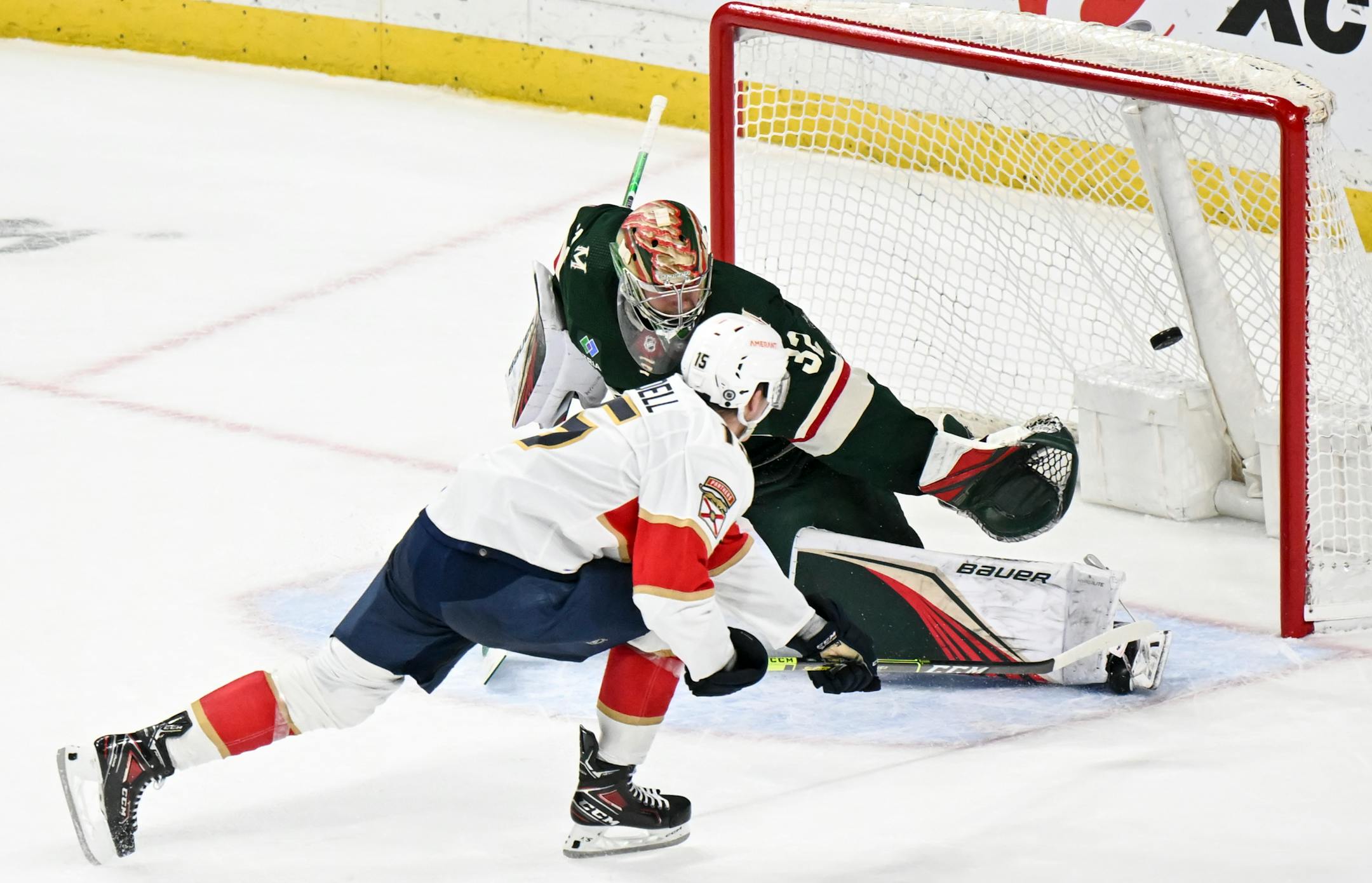 Florida Panthers center Anton Lundell (15) scores a goal against Minnesota Wild goaltender Filip Gustavsson (32) during an overtime shootout.