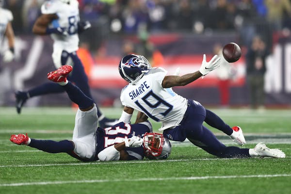 Tajae Sharpe #19 of the Tennessee Titans reacts for the ball against Jonathan Jones #31 of the New England Patriots in the second half of the AFC Wild