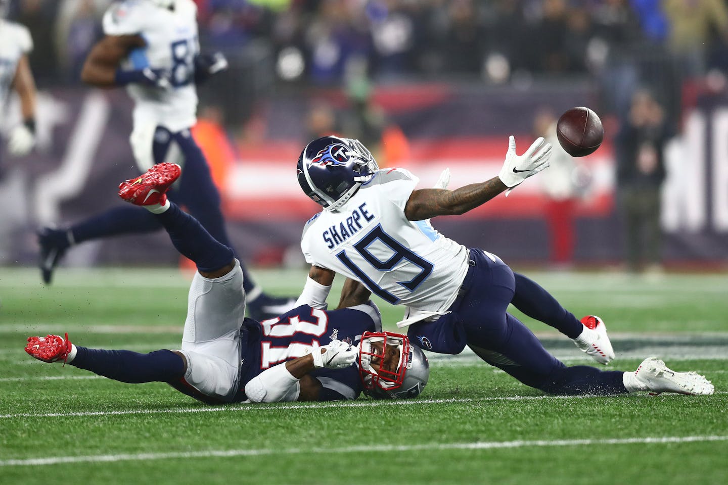 Tajae Sharpe #19 of the Tennessee Titans reacts for the ball against Jonathan Jones #31 of the New England Patriots in the second half of the AFC Wild Card Playoff game at Gillette Stadium on January 04, 2020 in Foxborough, Massachusetts. (Adam Glanzman/Getty Images/TNS) ORG XMIT: 1532599