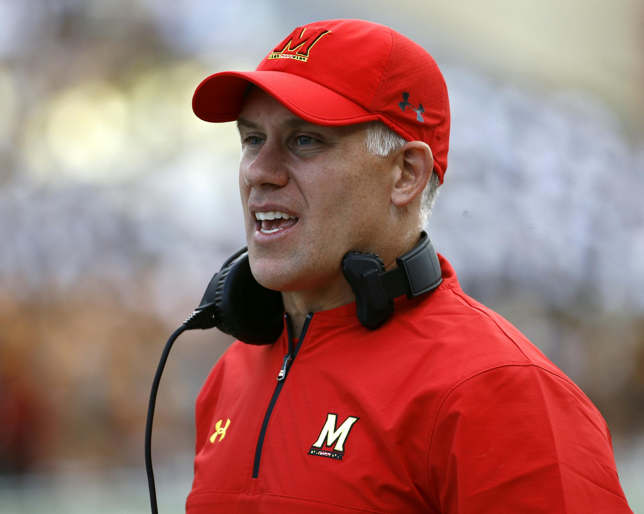 FILE - In this Saturday, Sept. 9, 2017, file photo, Maryland head coach DJ Durkin stands on the sideline during an NCAA college football game against Towson in College Park, Md. The University System of Maryland's board of regents announced Tuesday their recommendation that Durkin retain his job. Durkin has been on paid administrative leave since August, following the death of a player who collapsed during practice and an investigation of bullying by the Maryland coaching staff. (AP Photo/Patric