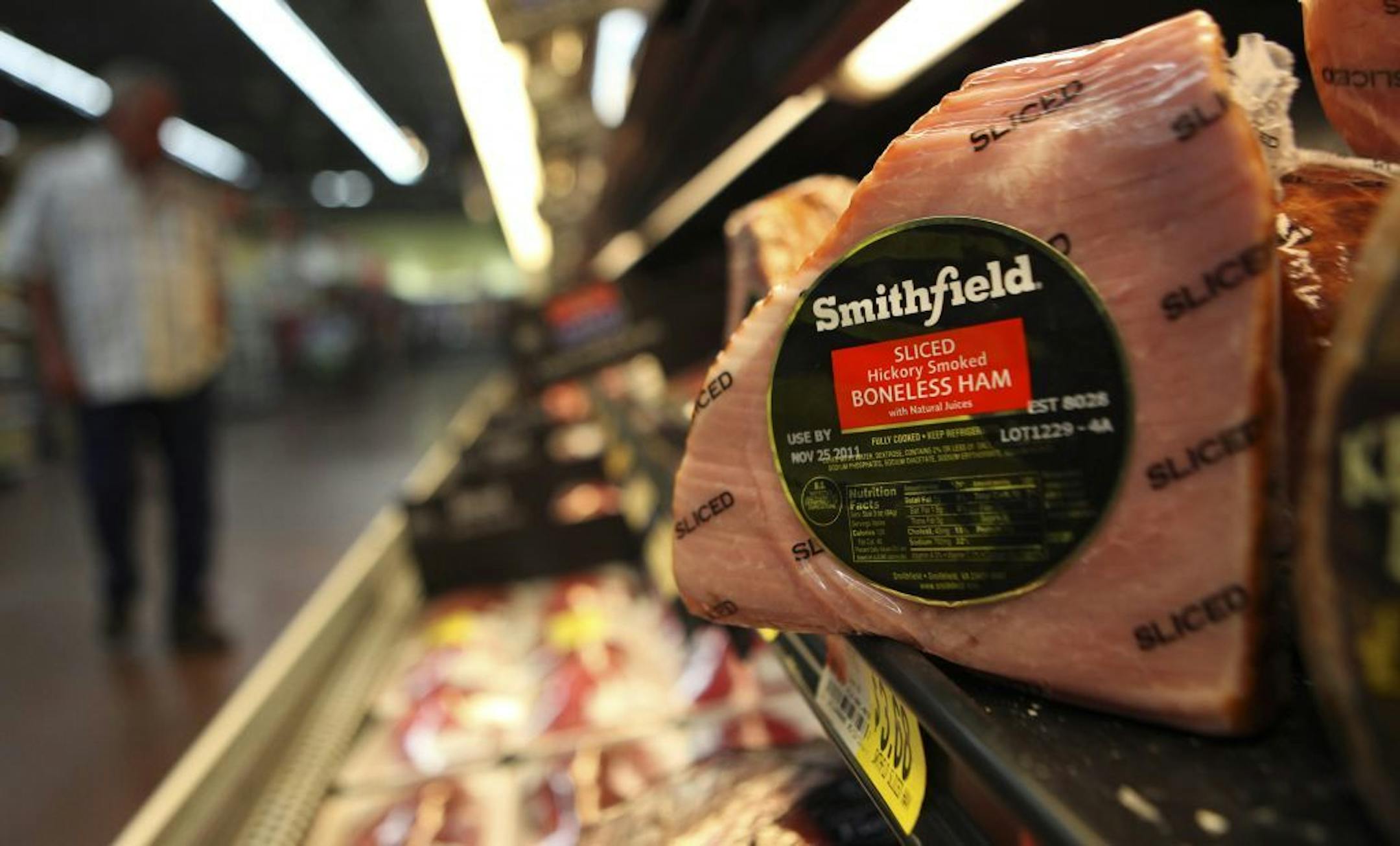 A Smithfield ham at a grocery store in Richardson, Texas. Chinese meat processor Shuanghui International Holdings Ltd. agreed Wednesday, May 29, 2013, to buy Smithfield Foods Inc. for approximately $4.72 billion in a deal that will take the world's biggest pork producer private.