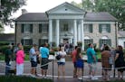 Visitors queue to enter the Graceland mansion of Elvis Presley on Aug.12, 2017, in Memphis, Tennessee. Elvis Presley, American icon and King of rock n