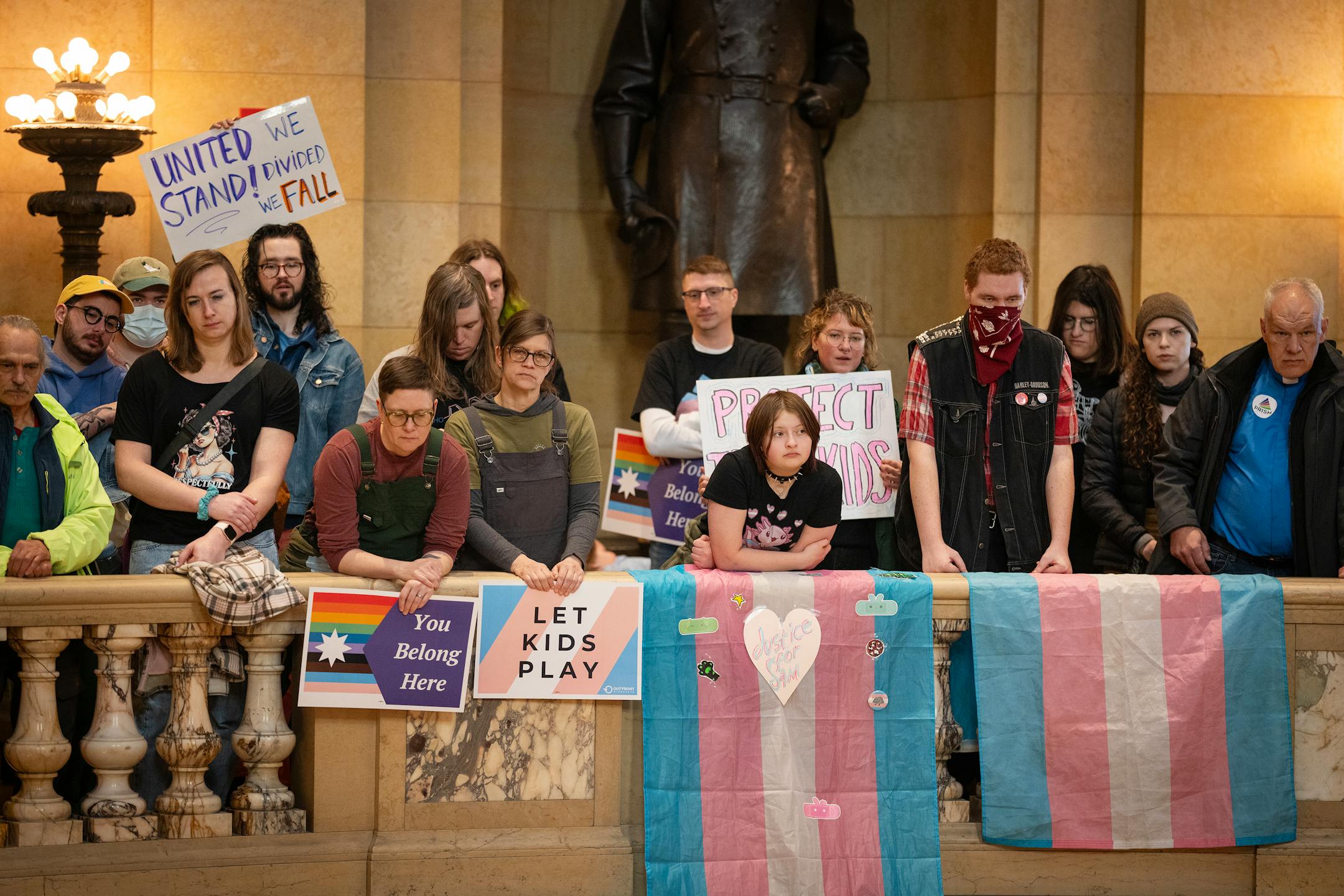 People listen to speakers during Transgender Day of Visibility at the State Capitol in St. Paul on March 31.